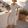 SolaraLuxe – Wrap-Front Wide-Leg Jumpsuit with Twist Waist - Esilora