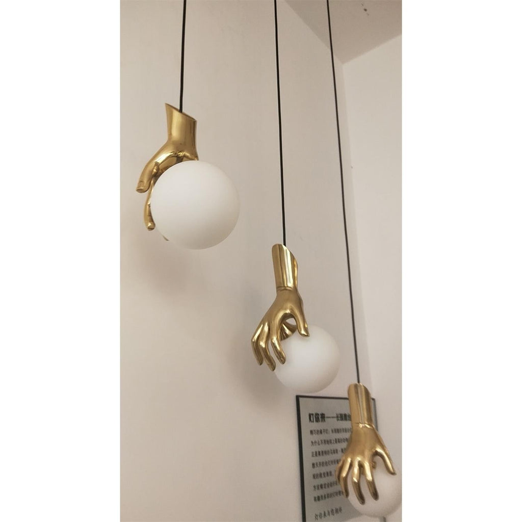 Hand Holding Globe Pendant Light | Esilora