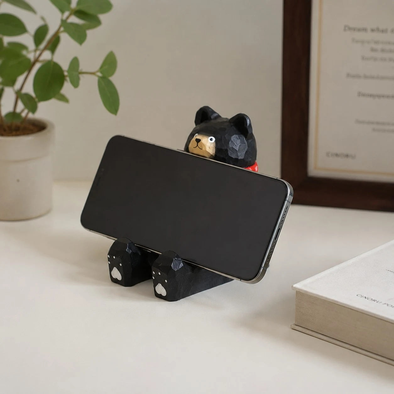 Support de téléphone en bois sculpté à la main représentant un animal | Esilora