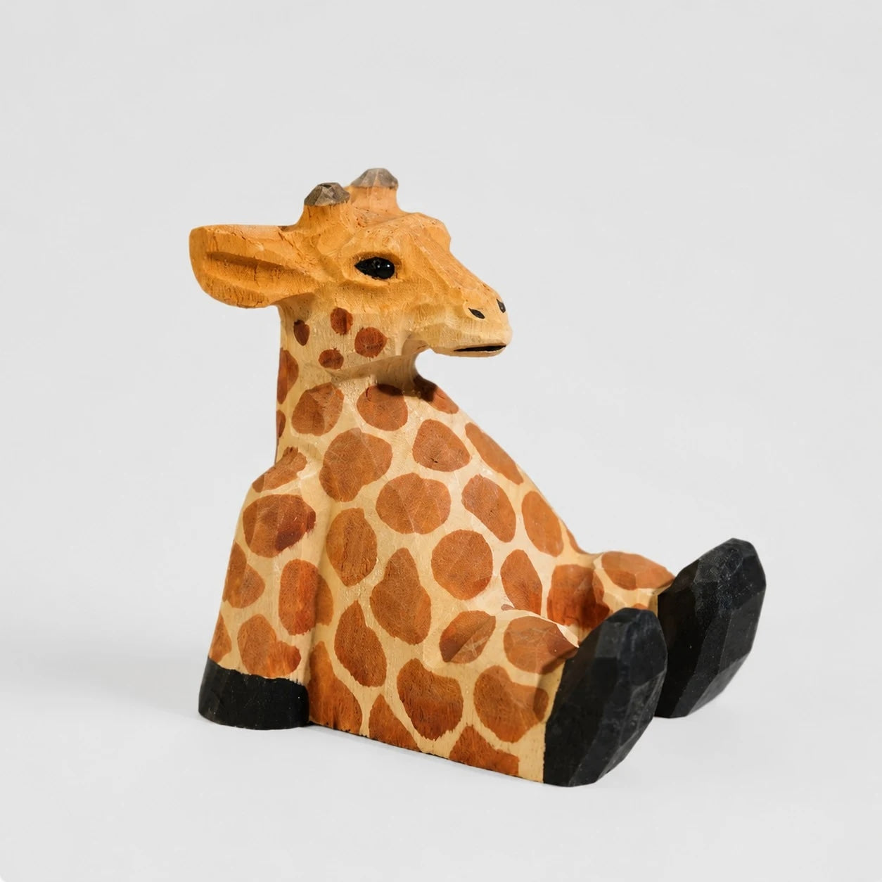 Support de téléphone en bois sculpté à la main représentant un animal | Esilora