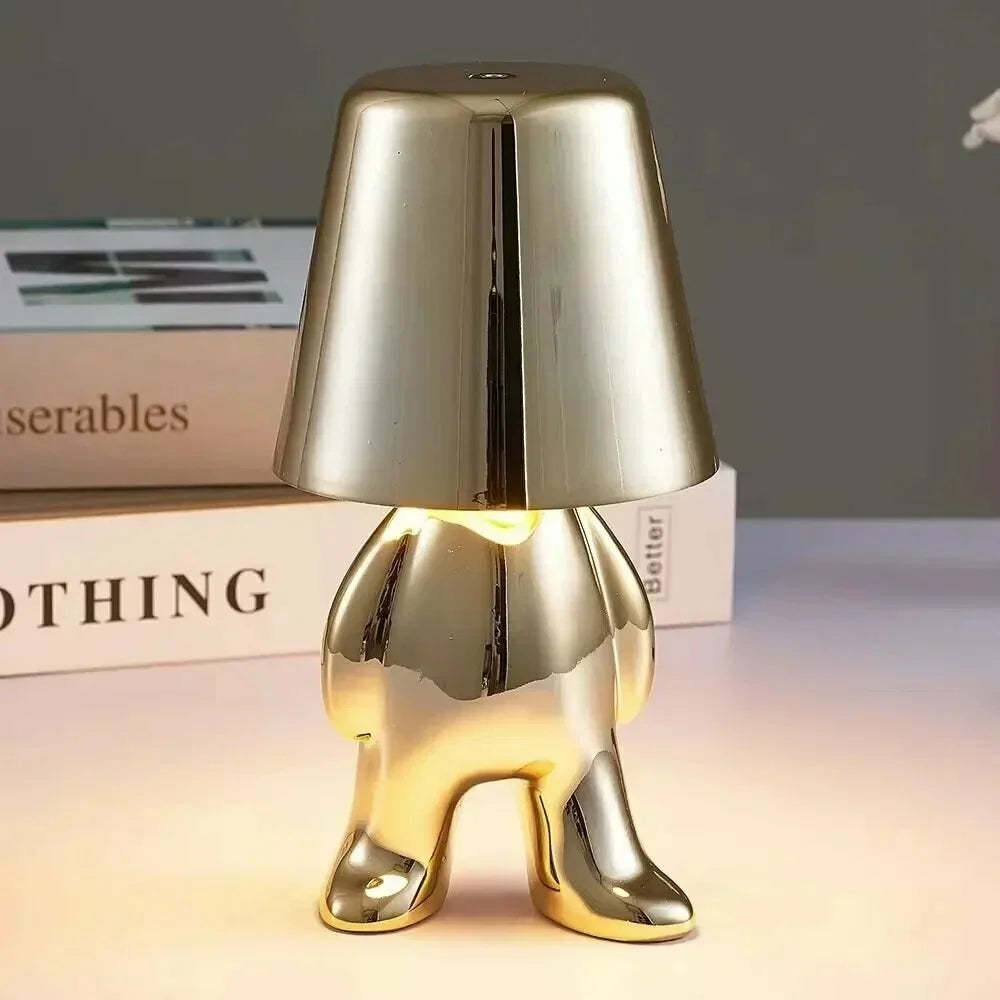 Modern bordslampa med LED och gyllene figurd design