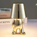 Modern bordslampa med LED och gyllene figurd design