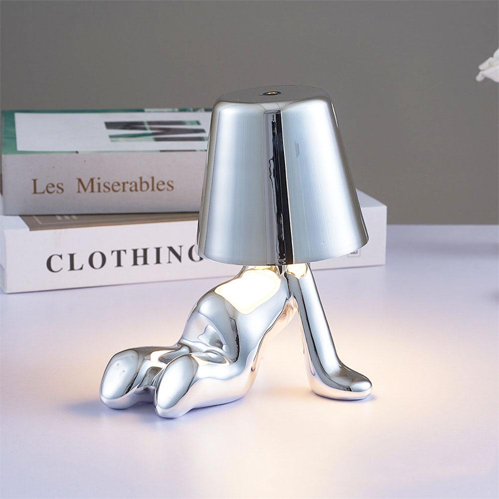 Modern bordslampa med LED och gyllene figurd design