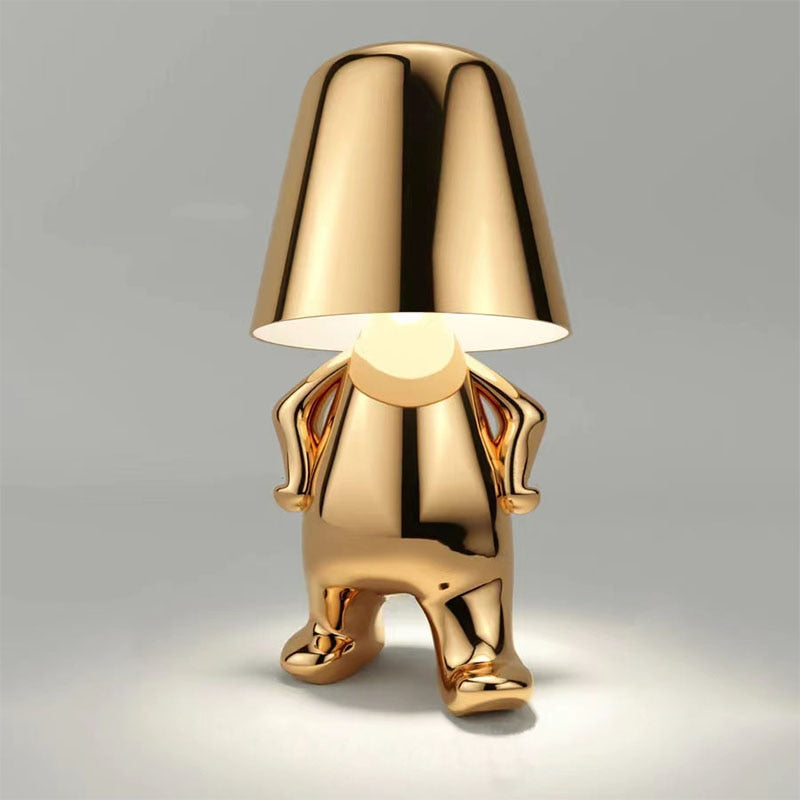 Modern bordslampa med LED och gyllene figurd design