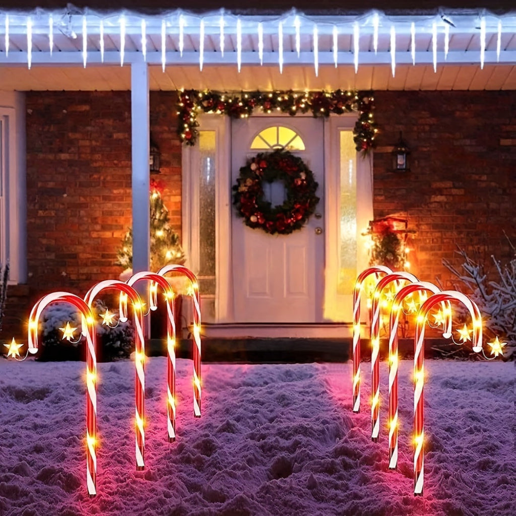 Luzes solares de plástico em forma de bengala doce, pacote de 12 — decoração de Natal com interruptor fotossensível automático