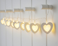 Guirnalda de luces LED en blanco cálido con diez estrellas de papel