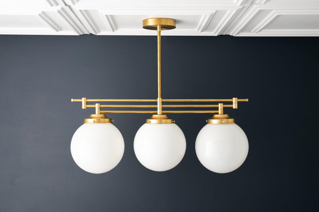 Lineární závěsné svítidlo Glorica Glass s elegantní řadou koulí - moderní stropní svítidlo ve stylu art deco do jídelny a kuchyně | Esilora