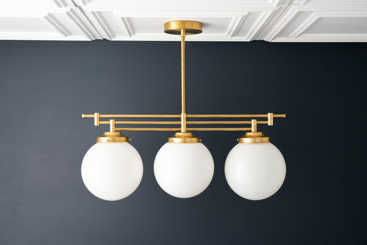Lineární závěsné svítidlo Glorica Glass s elegantní řadou koulí - moderní stropní svítidlo ve stylu art deco do jídelny a kuchyně | Esilora