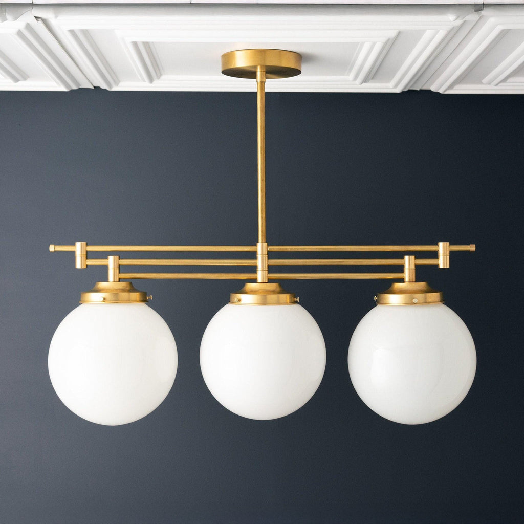 Lineární závěsné svítidlo Glorica Glass s elegantní řadou koulí - moderní stropní svítidlo ve stylu art deco do jídelny a kuchyně | Esilora