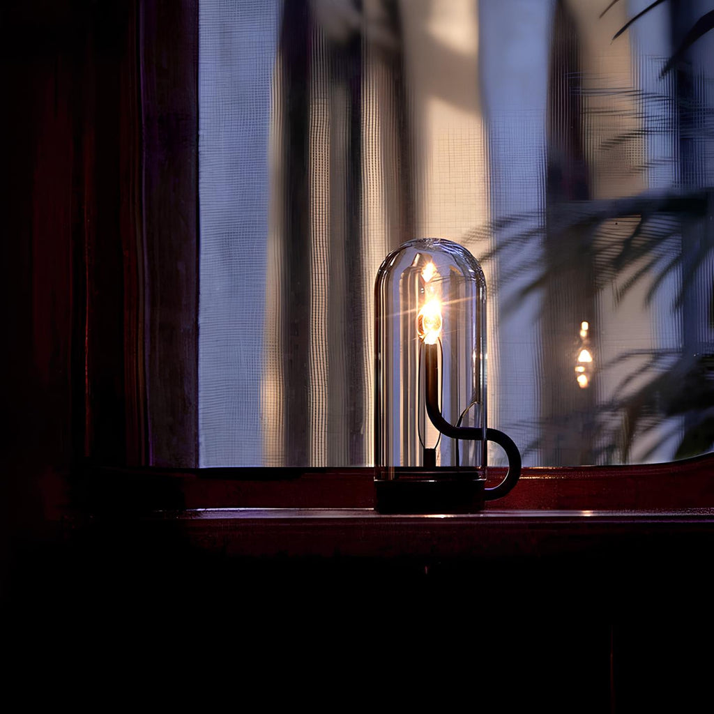 LED-bordslampa i glas — kinetiskt svängande hölje, magnetisk pendellampa